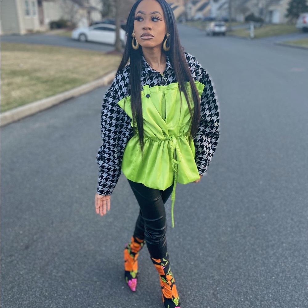 Houndstooth jacket with green overlay attached